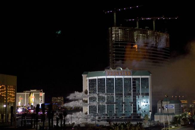 Charges go off inside the New Frontier hotel tower is imploded in Las Vegas, Nevada November 13, 2007. The casino on The Las Vegas Strip was purchased by Elad properties, an Israeli-owned real estate investment group, for more than U.S. $1.2 billion in May 2007. Elad Group, which also owns the Plaza hotel in New York, and the IDB Group are expected to build a multi-billion dollar Plaza-themed megaresort on the site. 